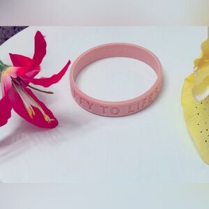 Never worn! “Key to Life” pink ribbon bracelet!